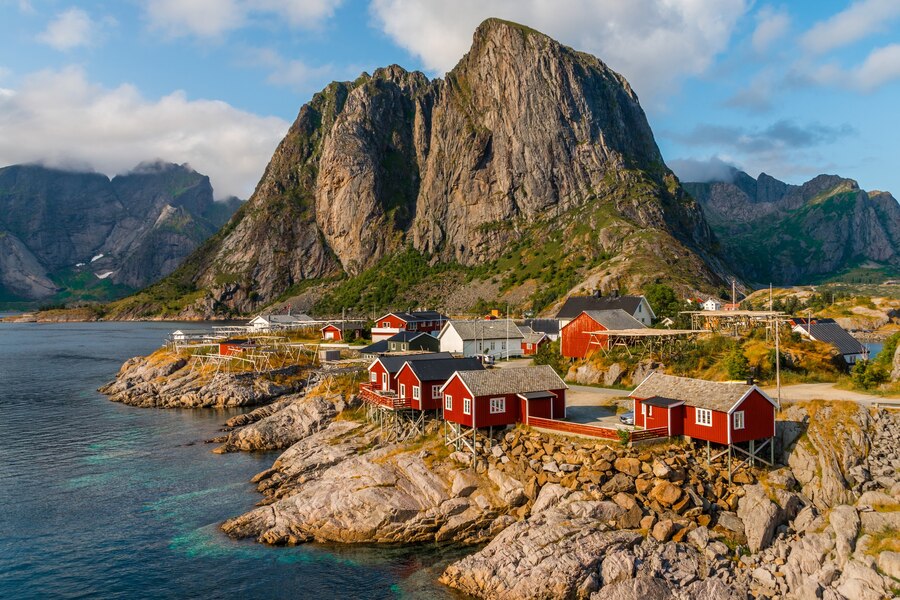 view-red-cottages-by-coastline-hamnoy-lofoten-islands-norway_181624-33160